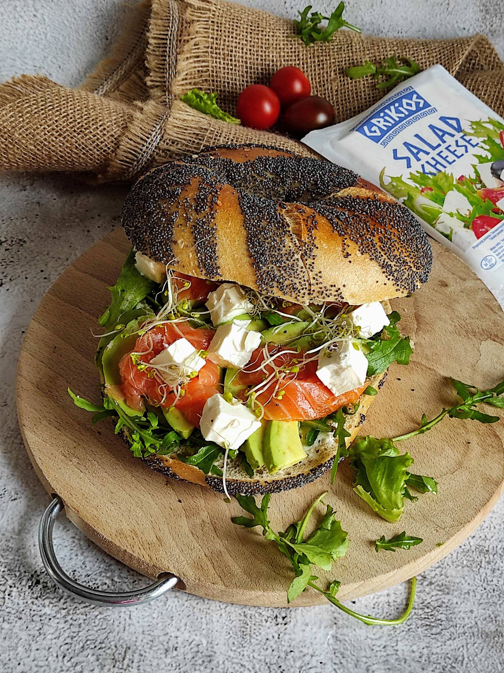 Bagel with avocado, cold smoked salmon and Grikios salad cheese